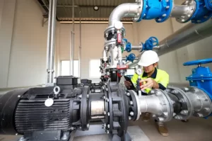 A worker checking the ball valve and globe valve